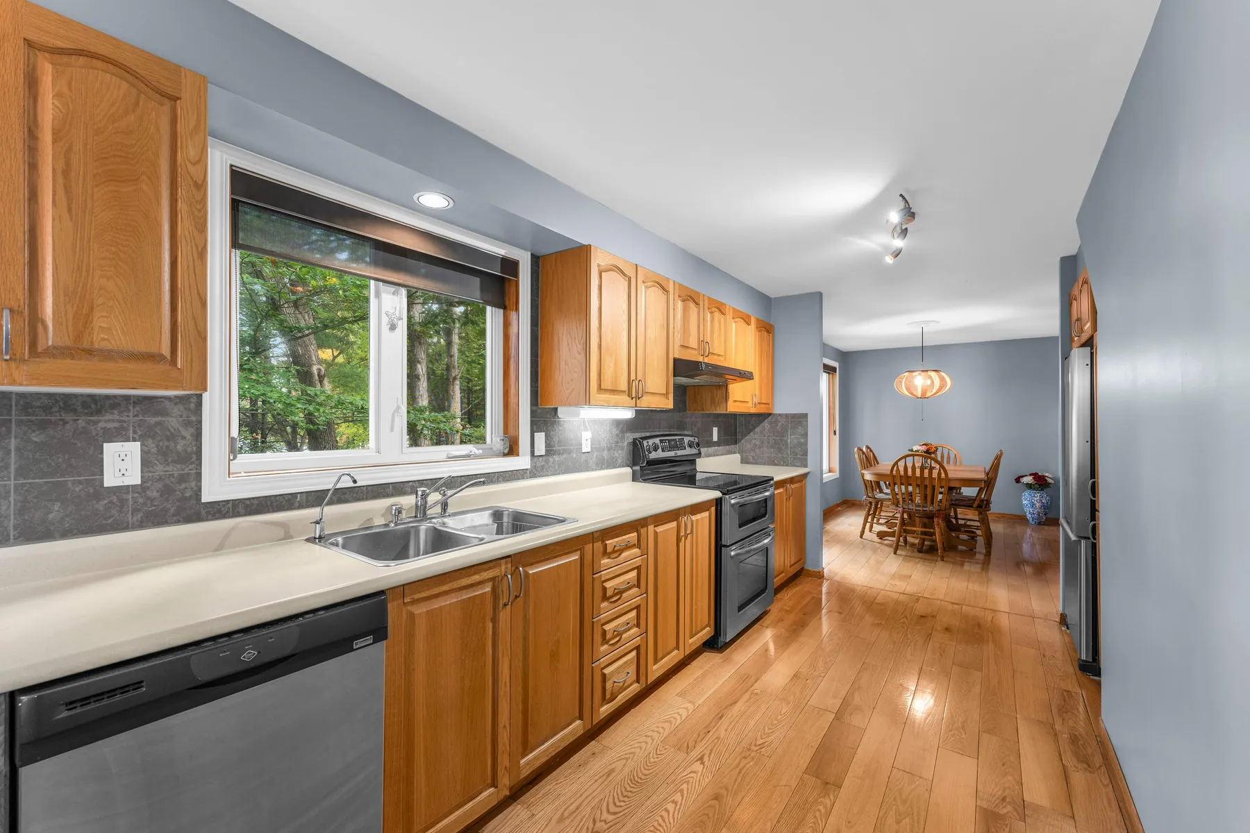 Kitchen with wood cabinets and hardwood floors